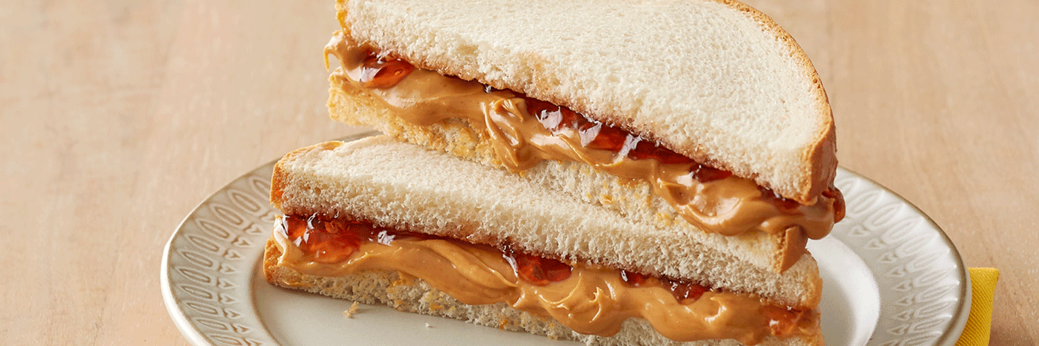 Regular Peter Pan Peanut Butter on a peanut butter and jelly sandwich